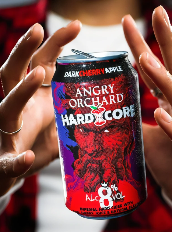 two hands around Angry Orchard Hardcore Dark Cherry Apple