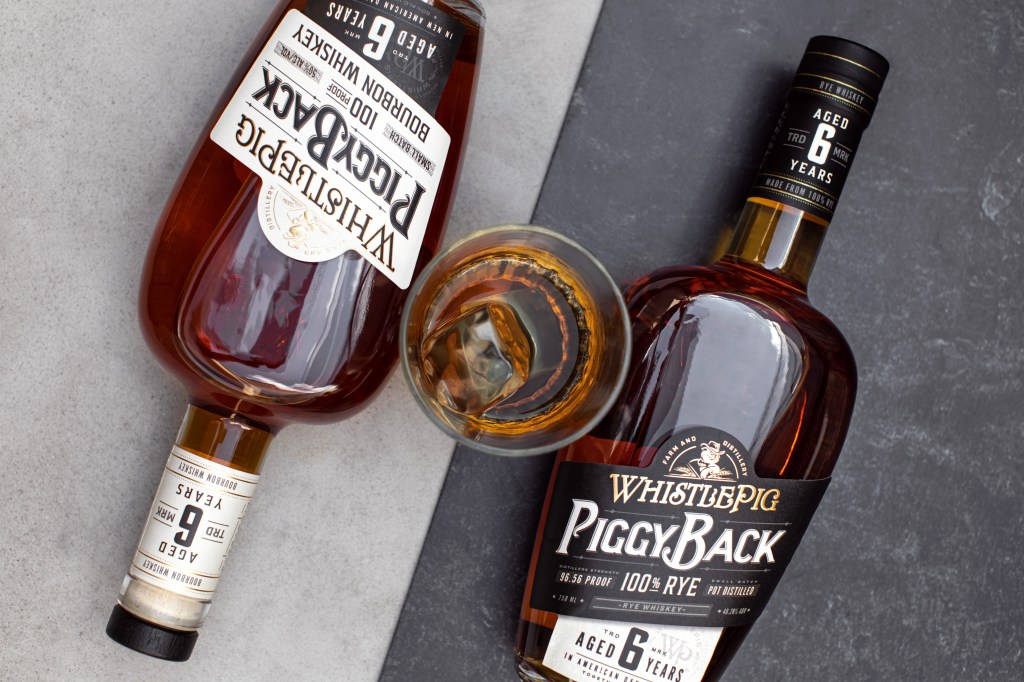 two bottles of PiggyBack whiskey