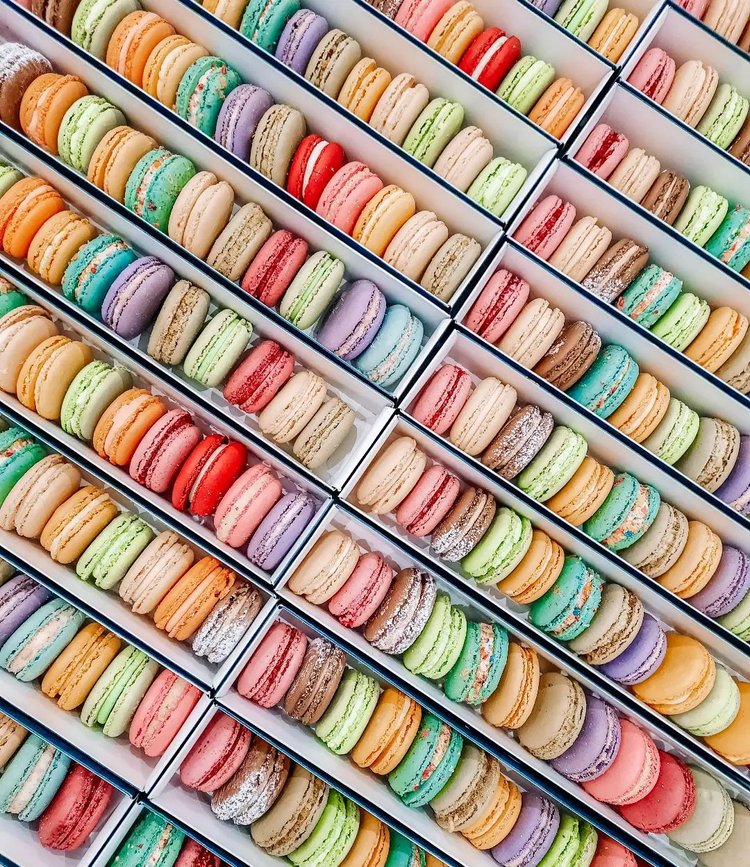 boxes of colorful macarons