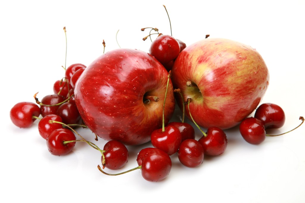 apples and cherries white background