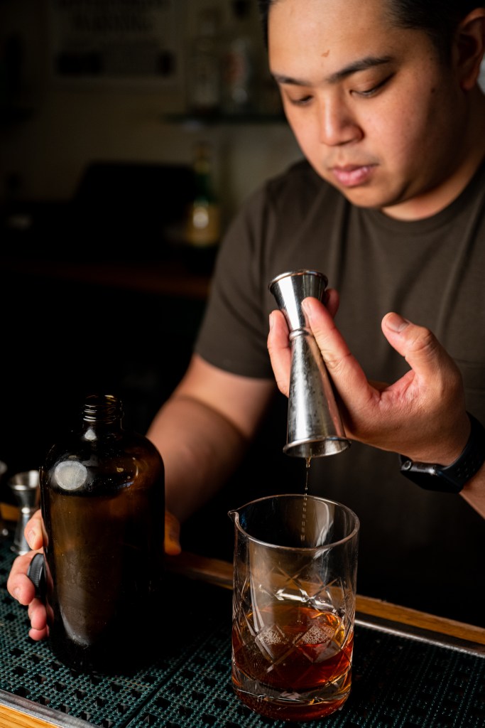 mixologist making a drink