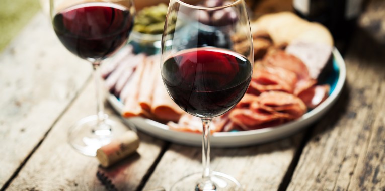 Two glasses of red wine with food