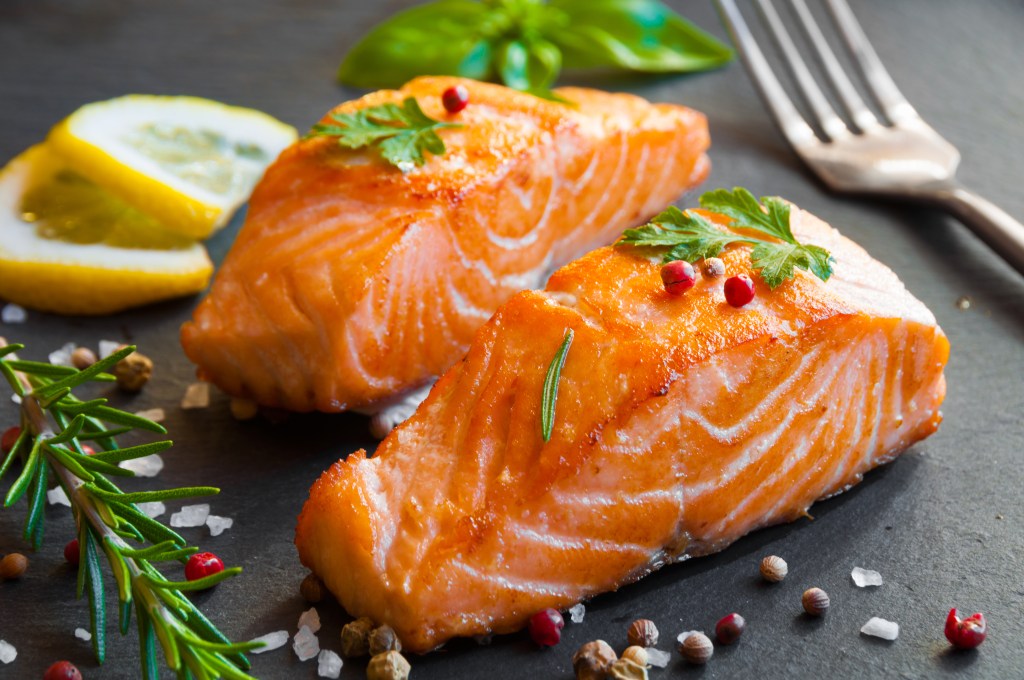 pieces of salmon on black slate