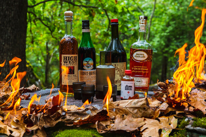 bottles of liquor by a fire