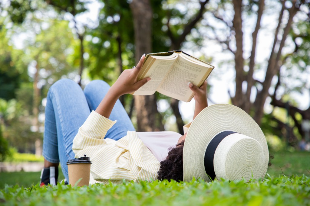 woman reading in the grass