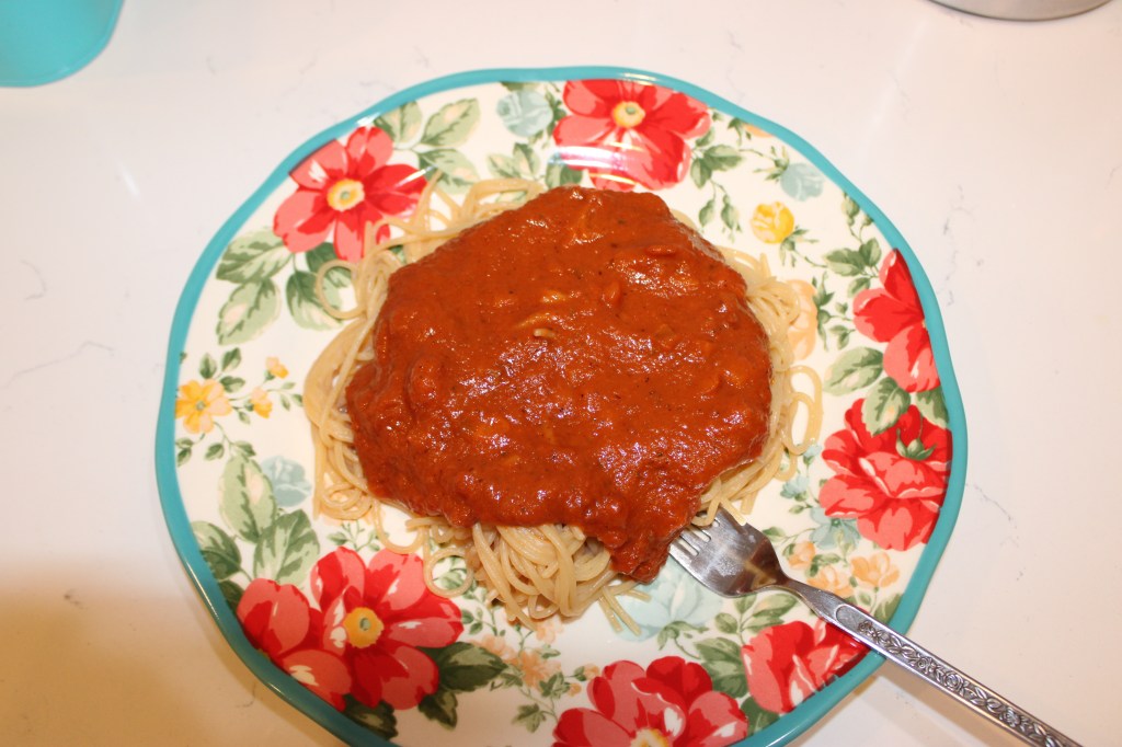 flowered plate with spaghetti